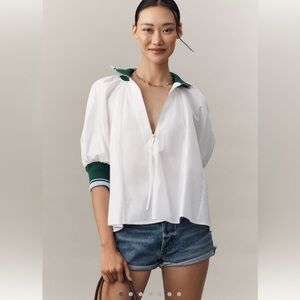 Anthropologie: Maeve White Blouse with Green Trim. Puff sleeves. Zipper v-neck